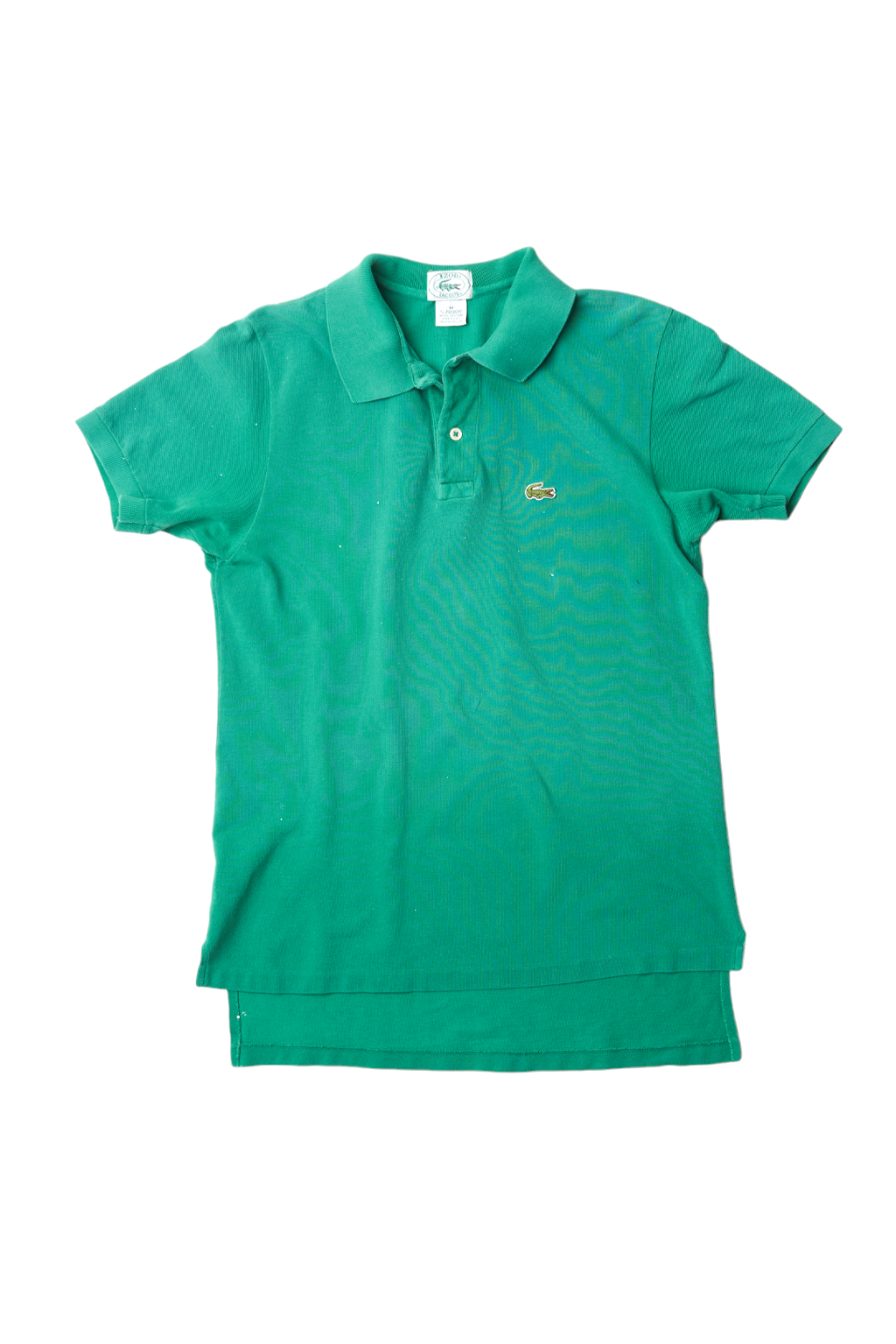 A green short-sleeve polo shirt with a small embroidered crocodile logo on the left chest, displayed flat against a white background.